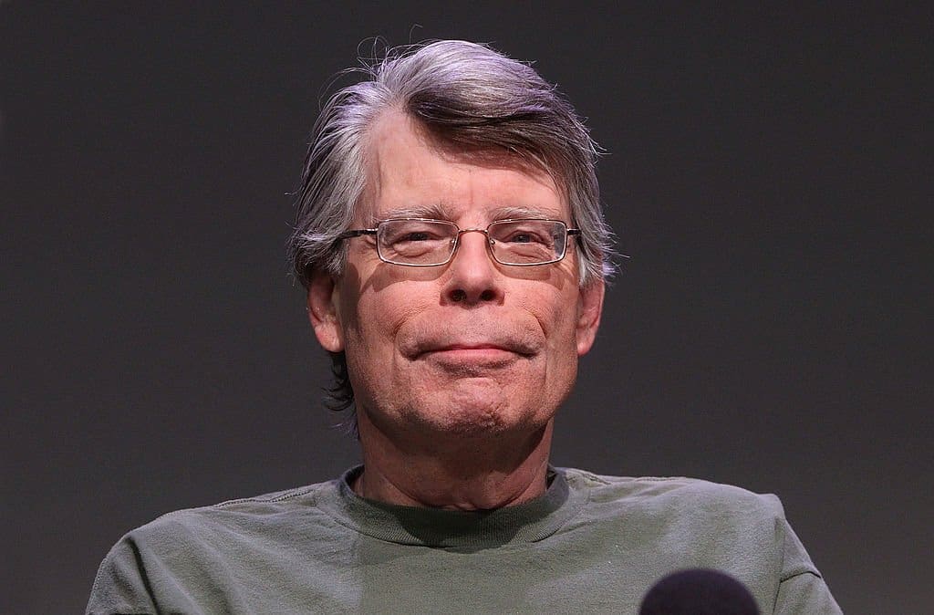 Stephen King with glasses in grey t-shirt